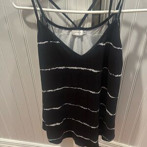 2- long tank tops. One maroon with flowers, one black with white designs.